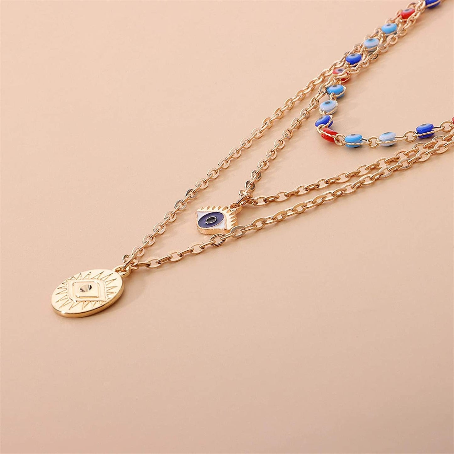 3 Layer Evil Eye Necklace Pendant With A Multi Layered Gold Chain To Wear As A Layered Nazar Necklace
